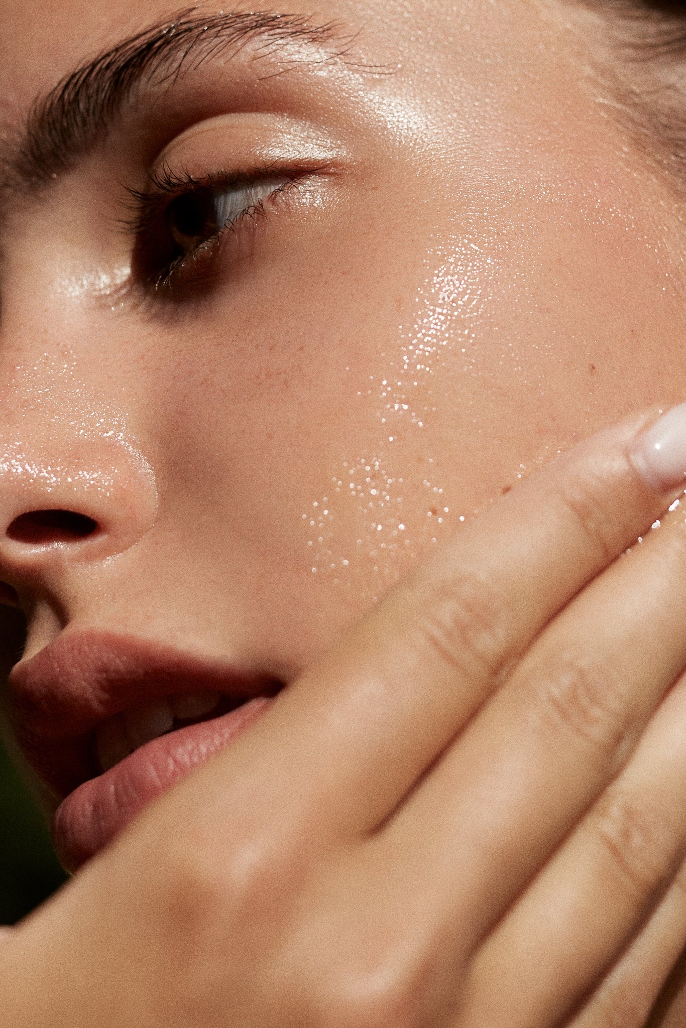 Second image of a beautiful model massaging the Papaya & Pineapple Enzymatic Cleanser by Fields of Yarrow on her cheeks