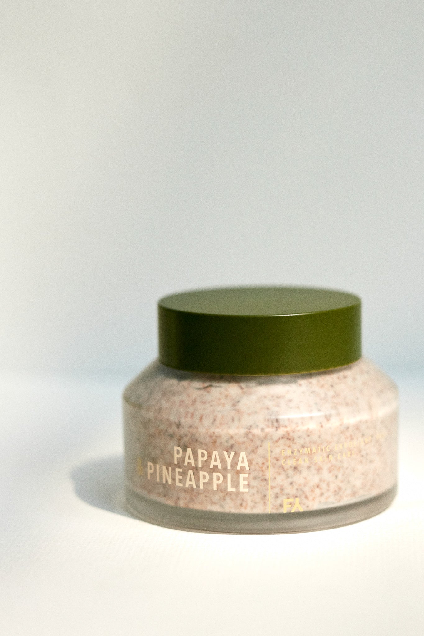 Still life photo of the papaya & pineapple enzymatic exfoliant by Fields of Yarrow with the closed lid